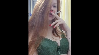 smoking strawberry blonde in green lingerie