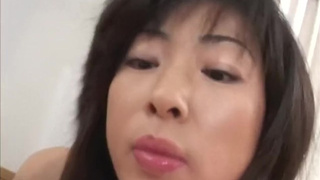 Titty fucking chinese MILF babe jerks cock